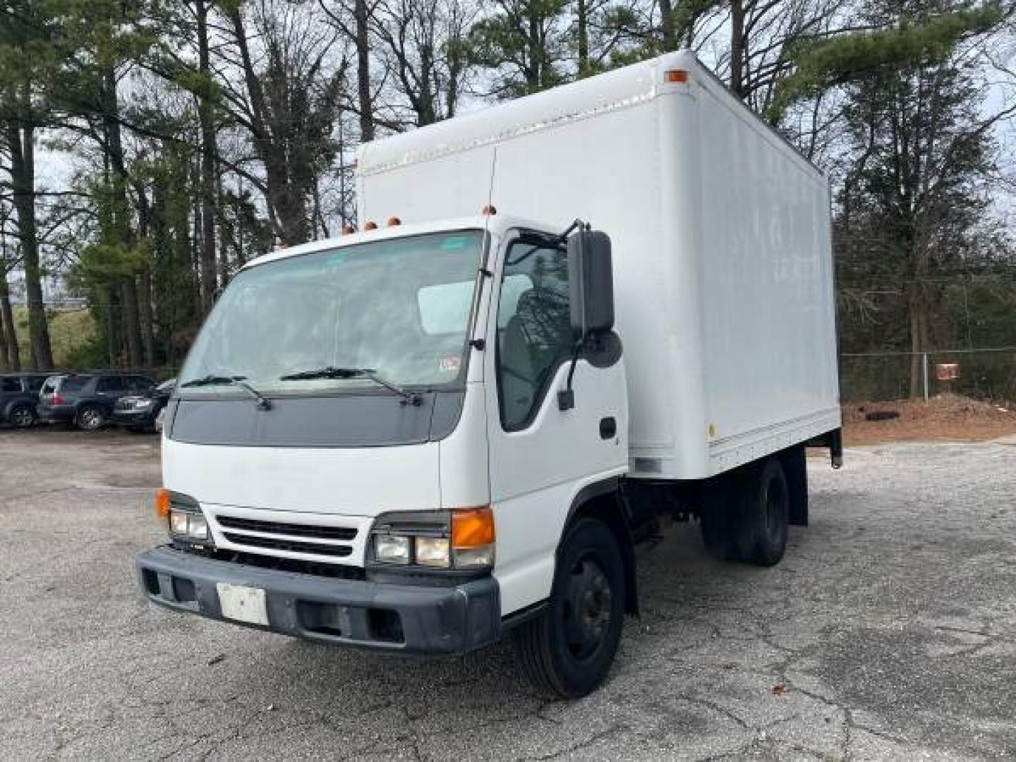 1999 white /gray Isuzu NPR (4KLC4B1R8XJ) with an 5.7 GAS V8 engine, Auto transmission, located at 5700 Curlew Drive, Norfolk, VA, 23502, (757) 455-6330, 36.841885, -76.209412 - -1999 Isuzu NPR 61k -Ready to work! -V8 gas motor -6 like new tires with great tread -12 ft box with roll up door -Tommy gate has been removed -No issues, runs and drives great -New state inspection -VADLR $250 processing fee. No other dealer fees. - Photo#0